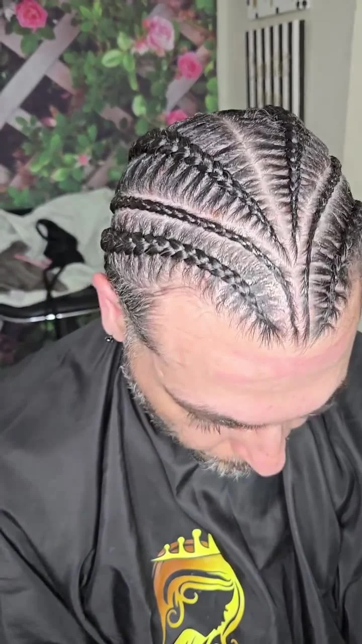 Top view of men's cornrows with clean parting